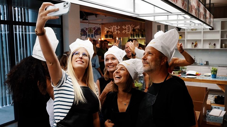 Smith & Nephew summer event film thumbnail: guests in chef hats taking a selfie