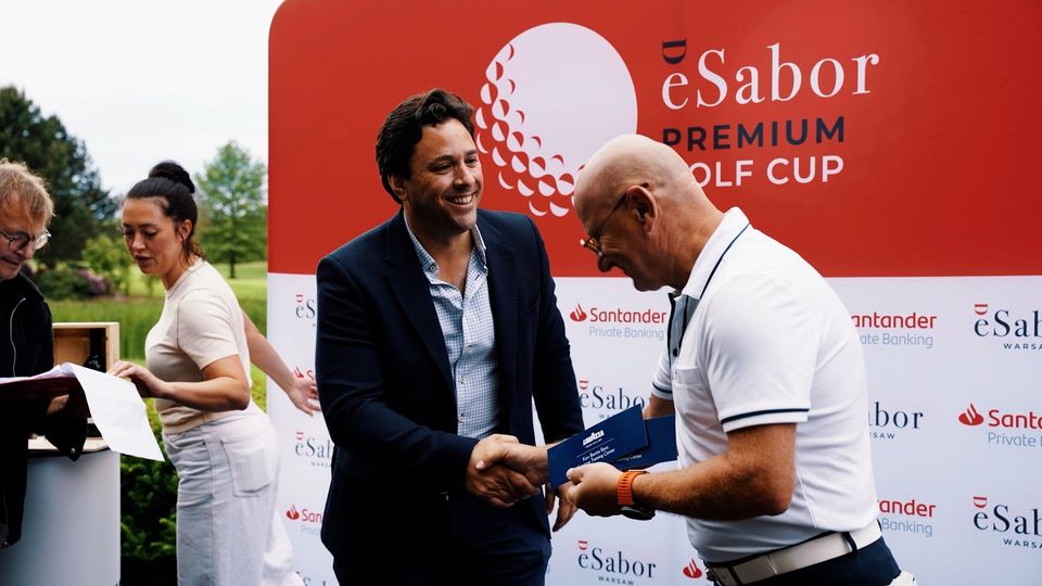 Summer golf tournament film thumbnail: guests shaking hands in front of a golf cup sponsor backdrop